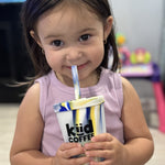 girl enjoying kiid coffee